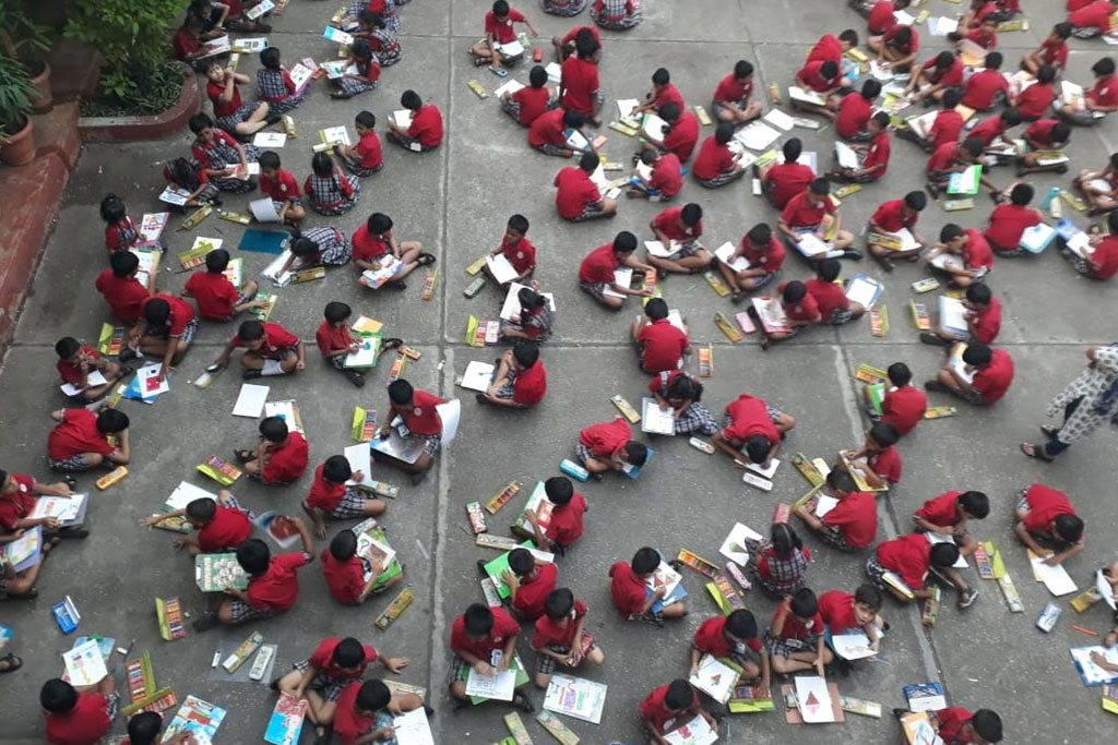 Primary students engaged in arts